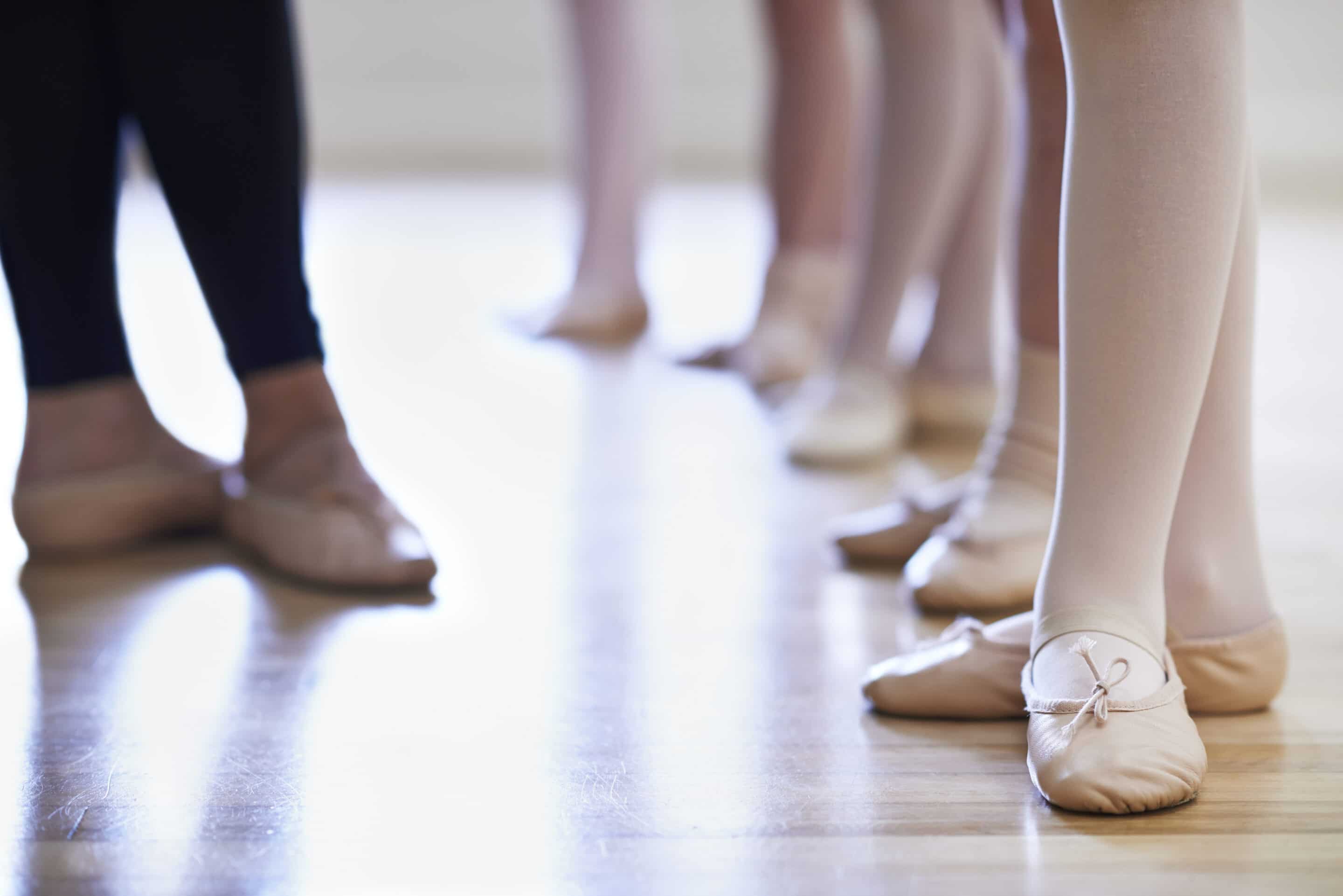 Teacher And Children’s Feet In Ballet Dancing Class